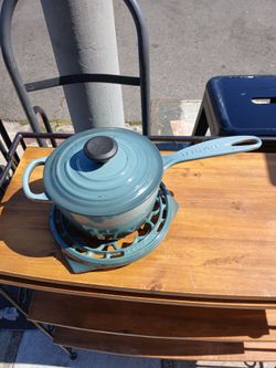 Le Creuset Signature Saucepan is enameled cast iron