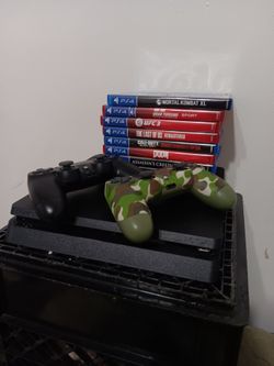 PS4 Console Bundle w/ 2 controllers & 9 games.