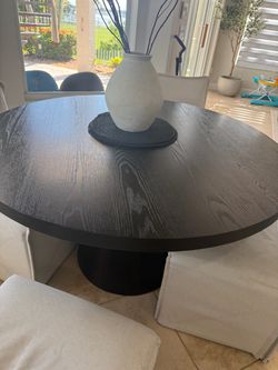 Black round 47” diameter city furniture table for sale.