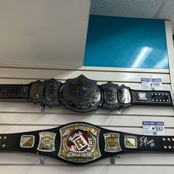 Signed wrestling championship belts