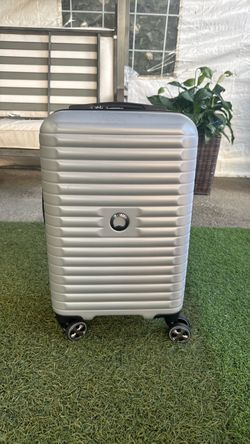 Delsey Paris Silver Hard Shell Spinner Luggage Carry on