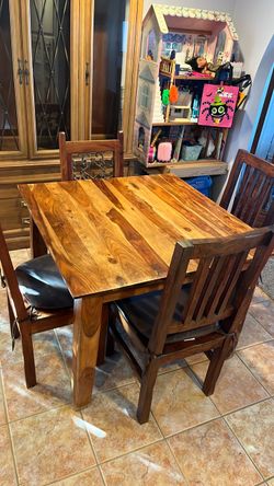 Table and 4 chairs. Real wood