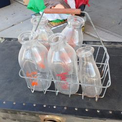 Old Milk Bottles And Carring Gage $40.00