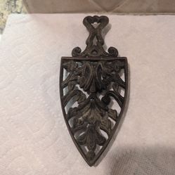 vintage cast iron trivet or sad iron stand