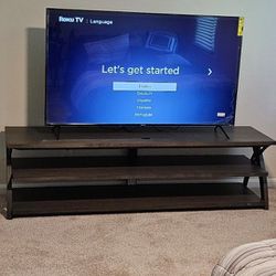 BRAND NEW 65 inch ROKU TV  and TV STAND!!!
