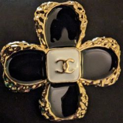 GOLD AND BLACK FLOWER BROOCH