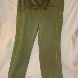 Men's Medium Puma jogging pants. Olive Dab & Green. Drawstring waist with Pockets and zippers at bottom by ankles. Excellent condition!