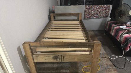 Bed frame with wooden pieces