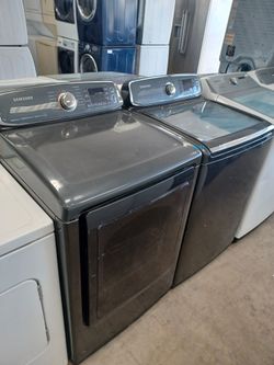 Samsung graphite gray he top load washer and electric dryer set