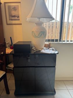 Black cabinet on wheels