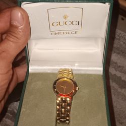 Gold Gucci watch