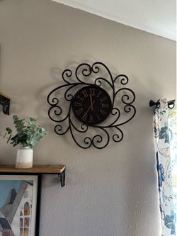 Scroll iron wall clock