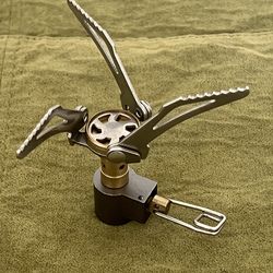 Ultralight backpacking or camping stove, designed for portability and efficiency in outdoor