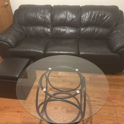 Black Leather Couch, Coffee Table, And Ottoman 