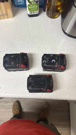 Three Milwaukee batteries M18 Red Lithium XC 5.0
