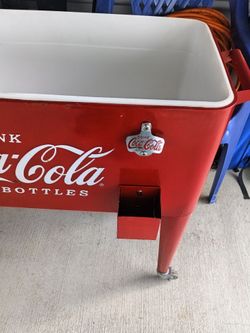 Coke ice cooler with bottle opener