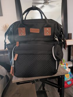 Black diaper bag with changing station