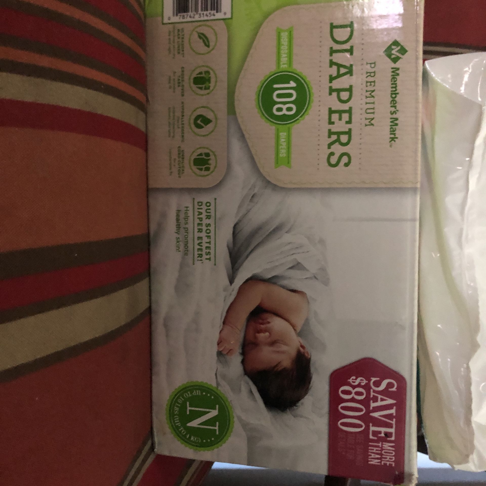 Box Of Newborn Diapers And A Pack Of Newborn Diapers 