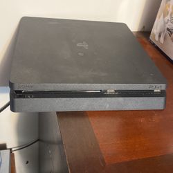 PS4 And Controllers With Games