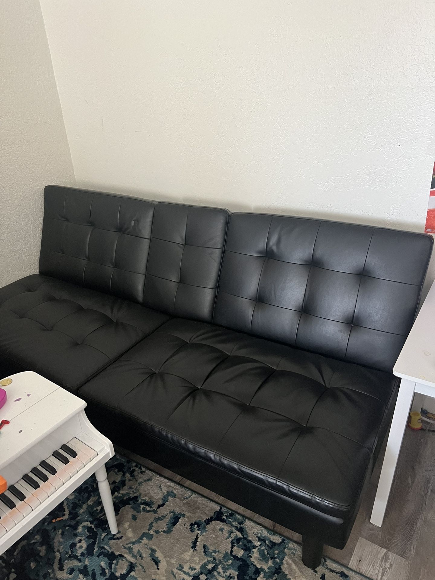 Renwick Luxury Goods Modern Faux Leather Futon with 2 Cupholders, black. Dimensions: 6 ft x 32 x 81 inches . In the sleeping position 6ft x 39 x 14