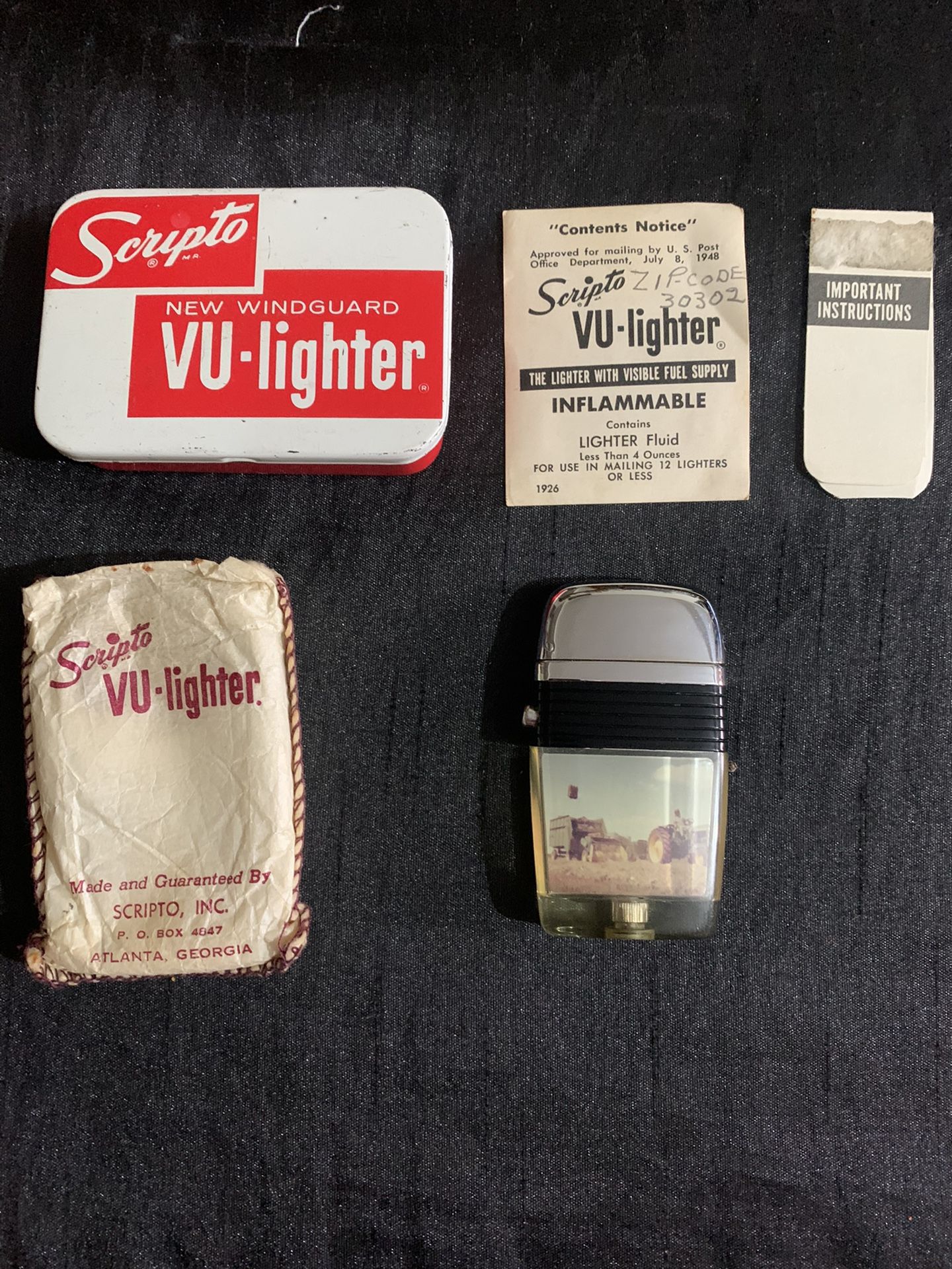 Vintage Scripto UV lighter with John Deere insert