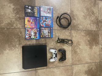 PS4 with 2 controllers and 6 games and wires