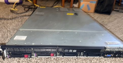 This appears to be an HP ProLiant DL360 G7 1U rack-mount server, identifiable by its slim chassis design and branding.