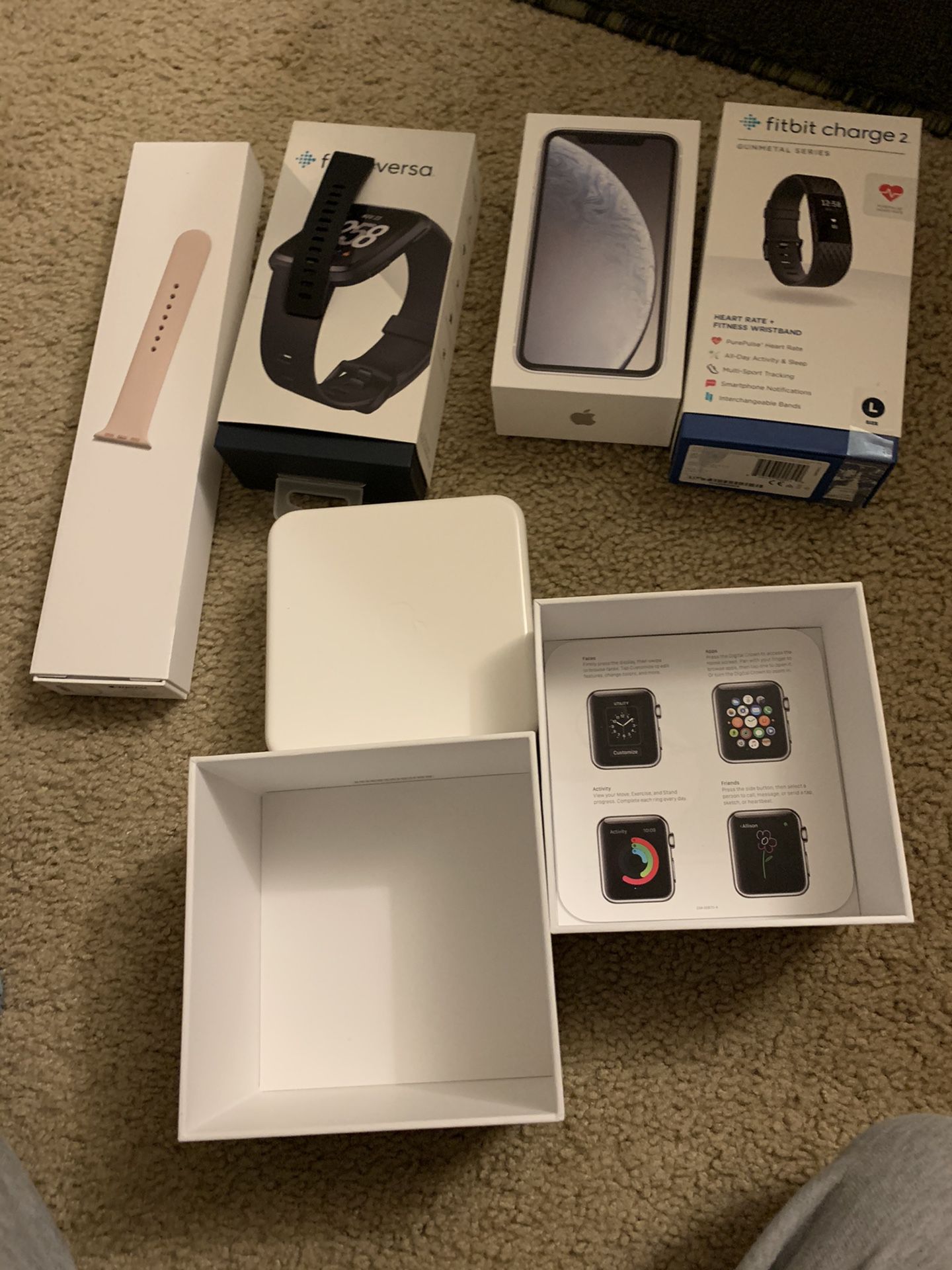 aple and fitbit versa just the boxes
