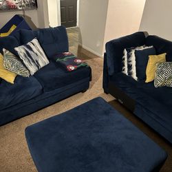 NAVY BLUE SECTIONAL COUCH AND OTTOMAN 