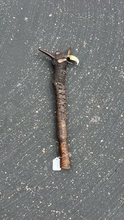 Hand carved seal tooth club