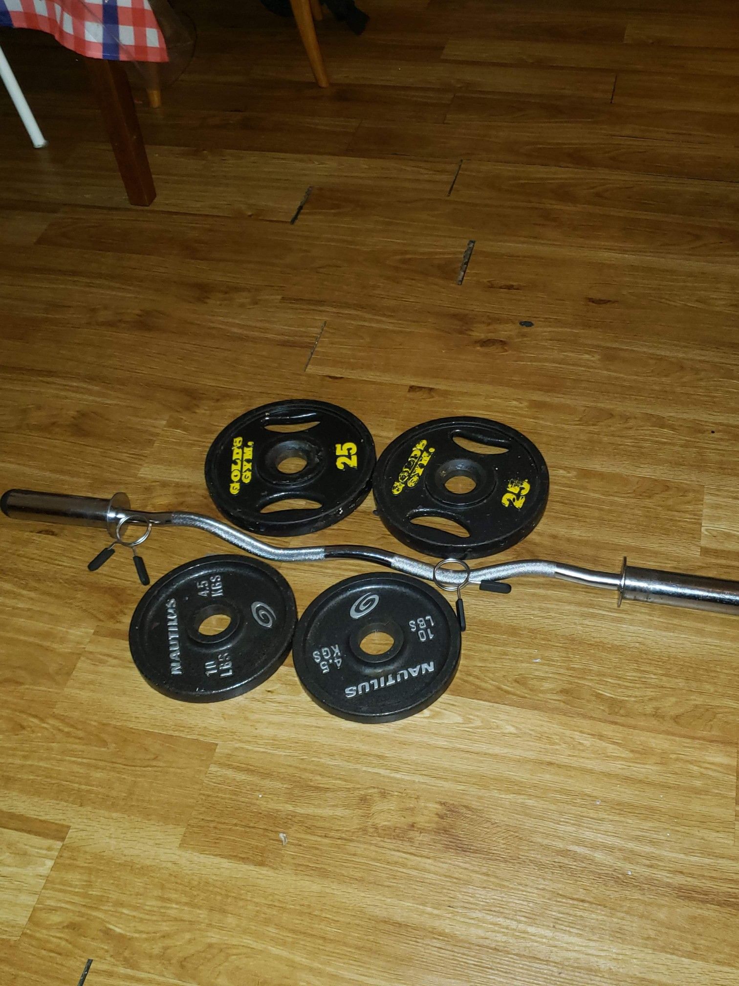 Gold gym and nautlius weights with bar