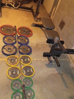 300 LB OLYMPIC WEIGHT SET AND A BENCH