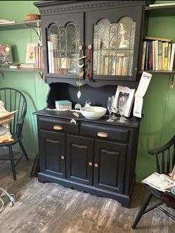Rustic farmhouse-style black wooden hutch and buffet cabinet