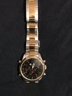 Nice watch gold and stainless steel with an adjustable band it’s a knock of