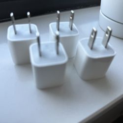 Four Apple USB Power Adapters