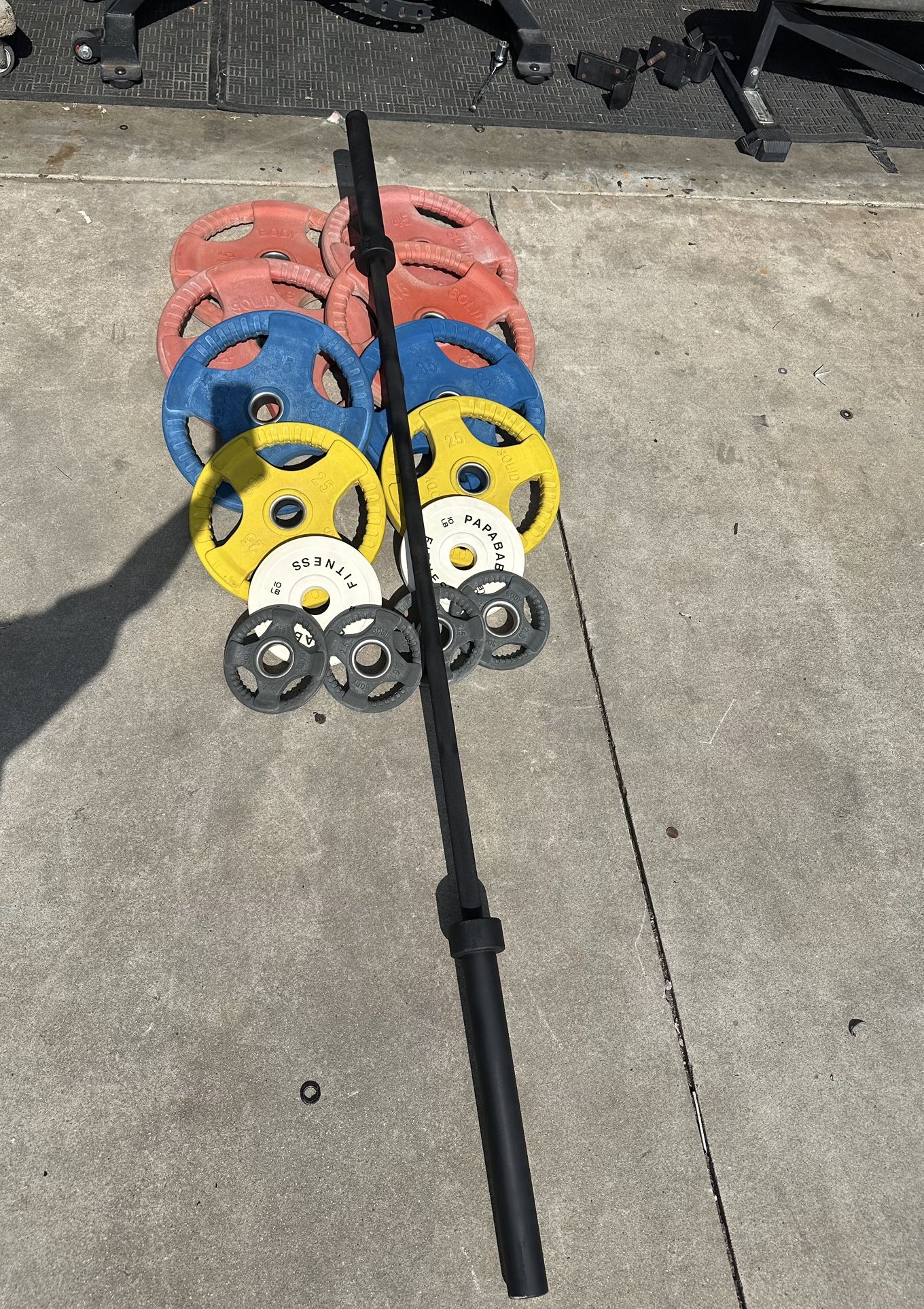 Olympic weights set 330lbs total plus 7ft 45lbs bar