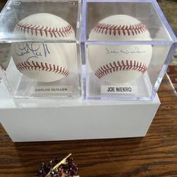 2 Autographed Baseballs In Cases