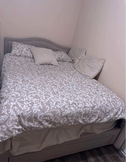 Grey Queen upholstered bed frame with storage