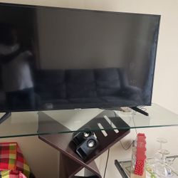 Tv With Glass Table And Two Chairs 