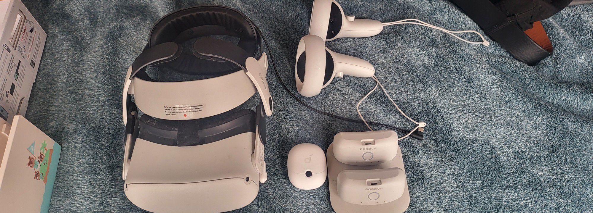 Meta Quest 2 With Bobo Vr Charging Headset 2 Battery Packs And Soundcore Wireless Earbuds