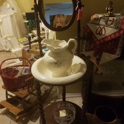 Antique washstand basin with mirror, candleholder in wood.
