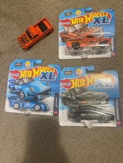 Hot  Wheels Xl metal lot of 4   two Silverado’s  ‘83,  One Nissan Skyline and one  Porsche 934.5