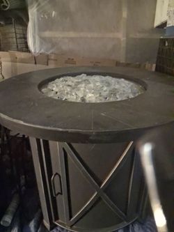 Cool outside table with glass embers turn fire orange keeps warm in winter