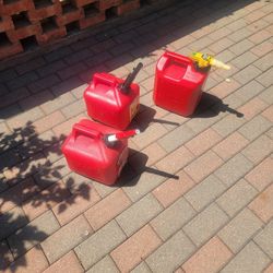 Three Gas Cans. Two Of Them Are 2 Gallons One Of Them Is 2 1/2 Gallons Must Buy All