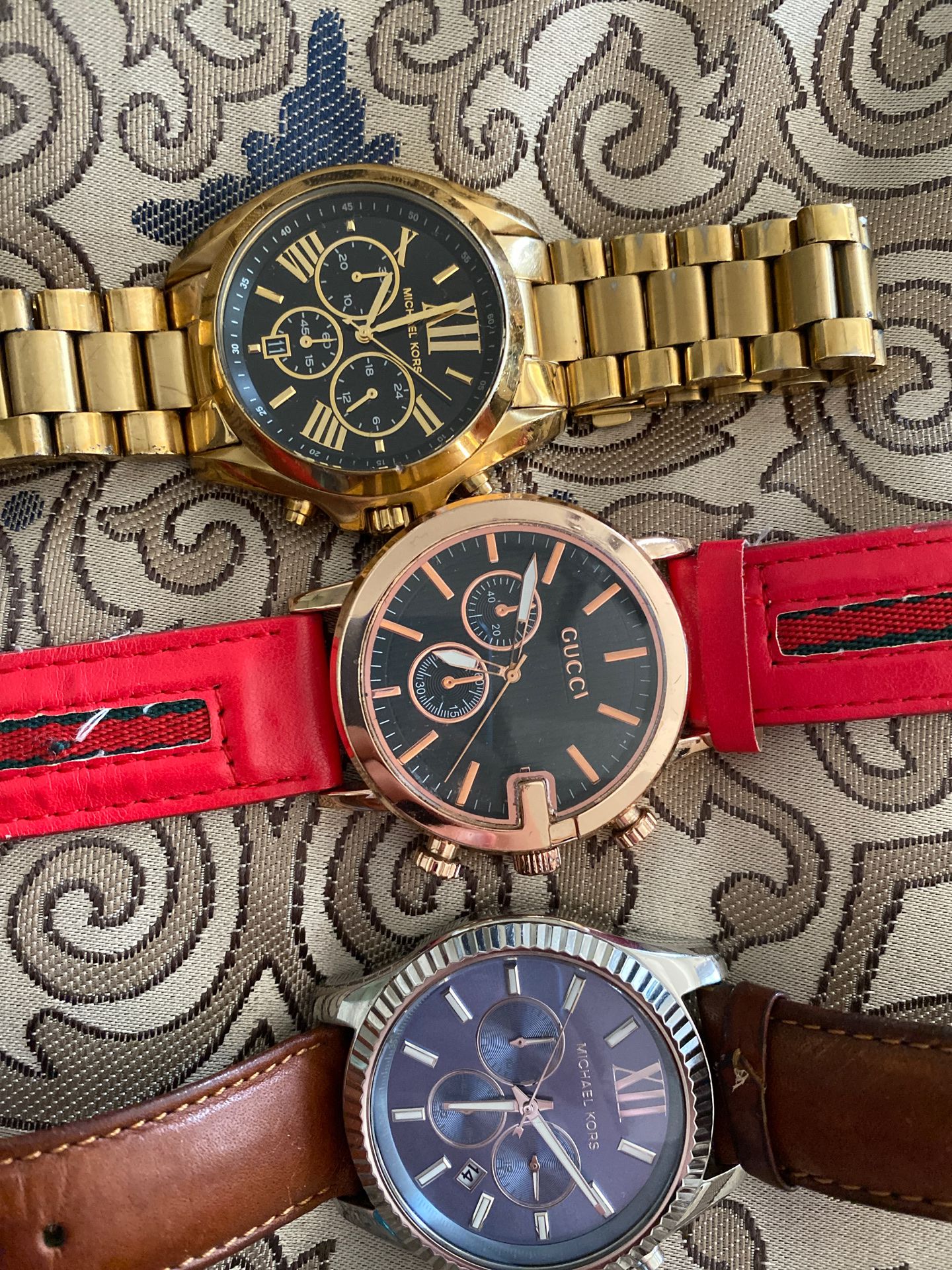 2 MK watches 1 Gucci watch