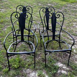 Four Heavy Wrought Iron Chairs 