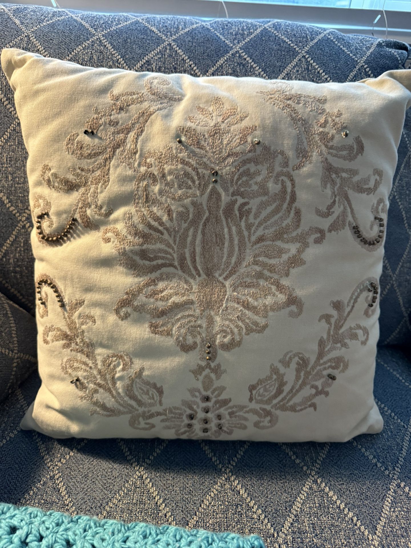 10. Throw pillow with intricate design.