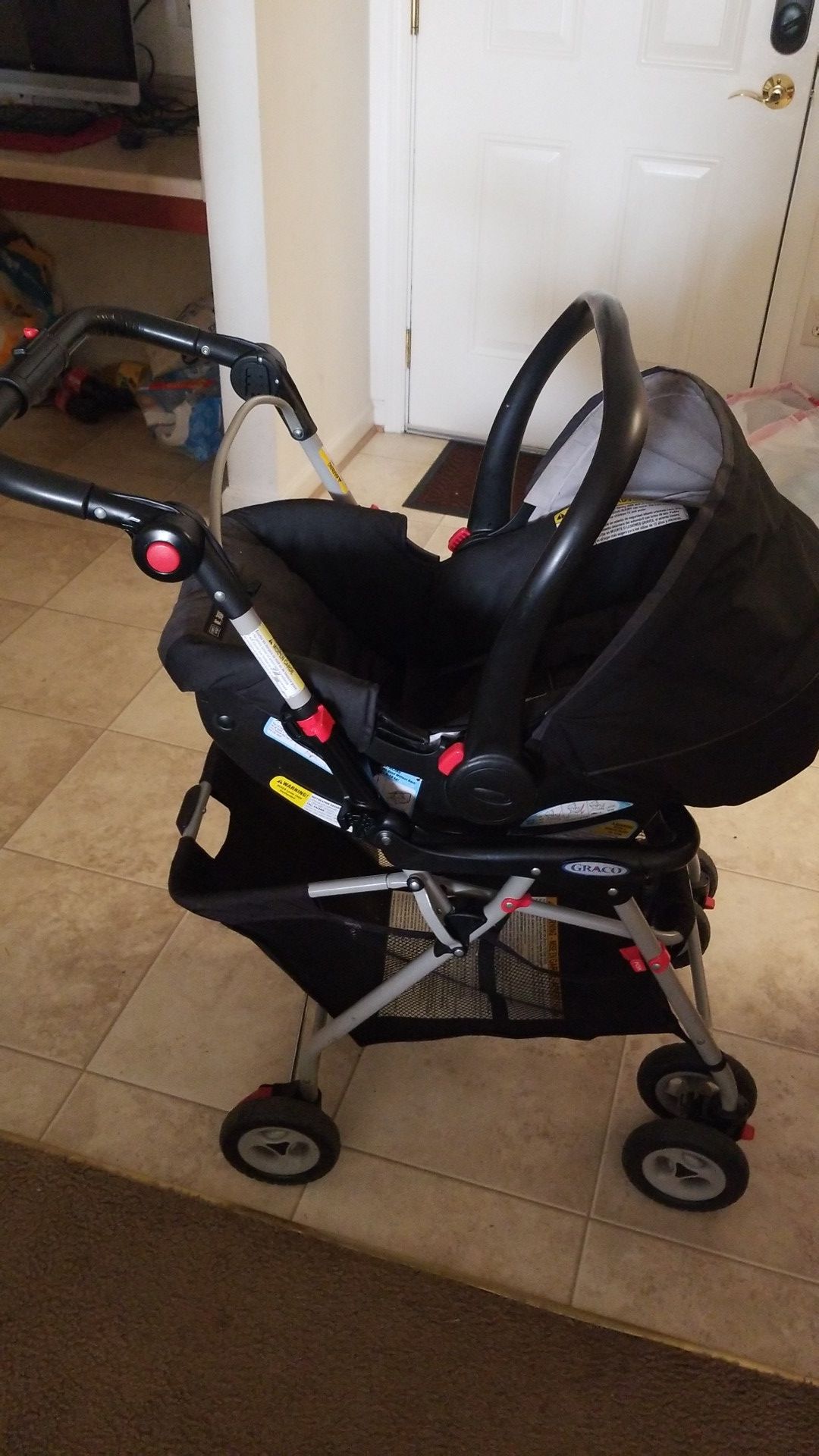 Graco car seat with stroller.