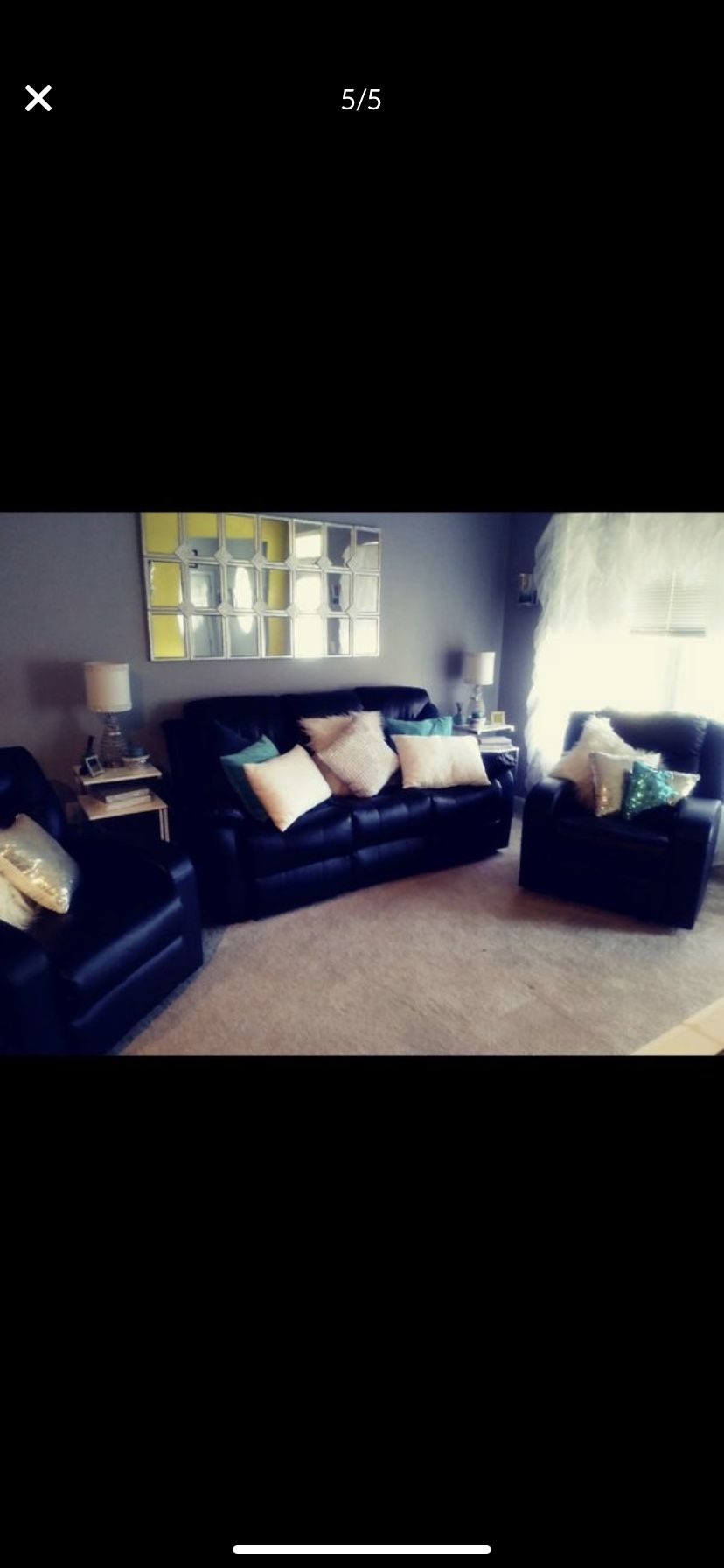 black leather sofa with reclining chairs or each end and two additional recliners