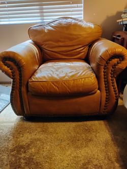Beautiful Full-sized Leather Chair w/bronze buttons